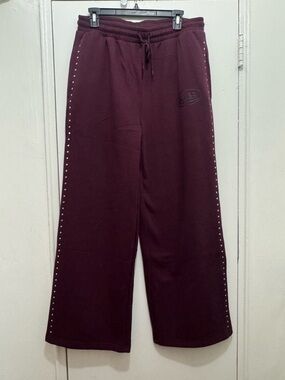 Van Dutch women’s burgundy sweatpants with double row silver studs size XL